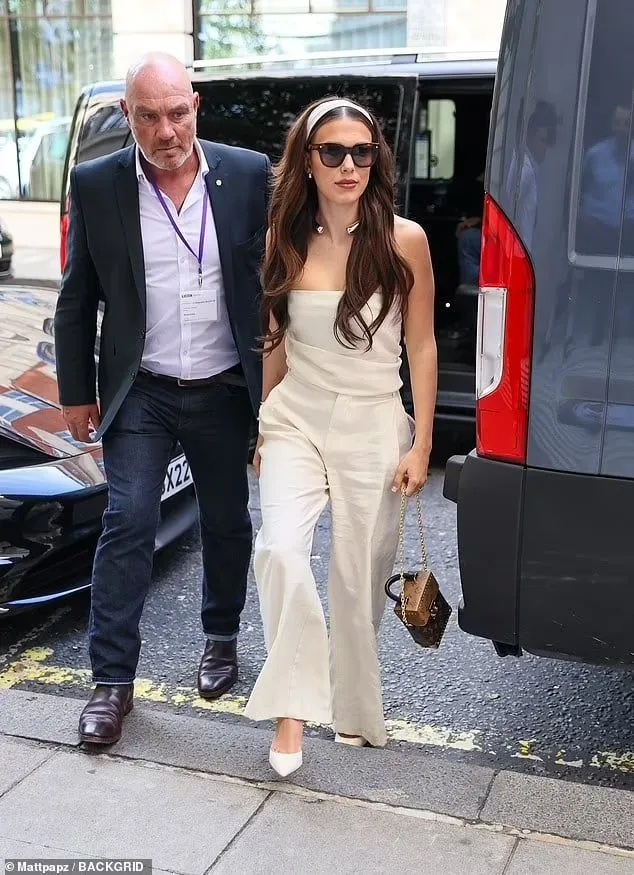 A Sectech officer walking a client from a car to a venue