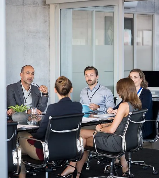 A meeting around a boardroom table
