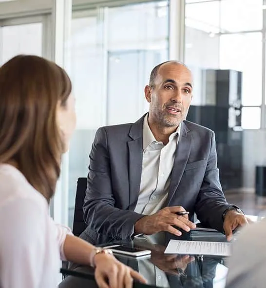 Two colleagues talking in an office